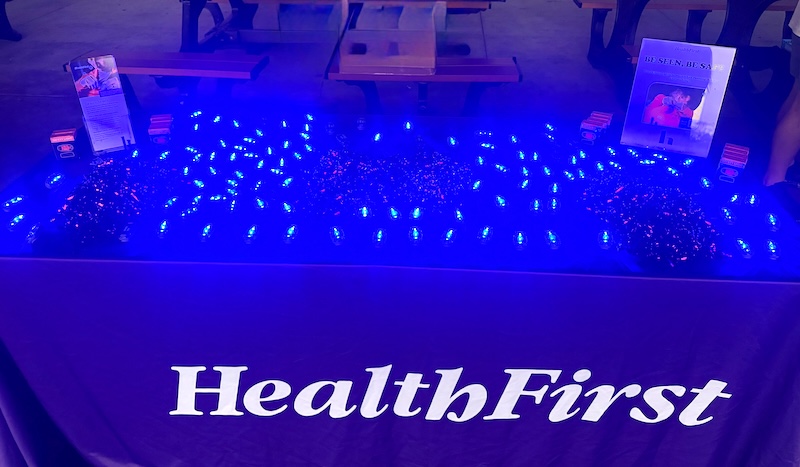 Health First gives away flashing lights for the Be Seen, Be Safe program