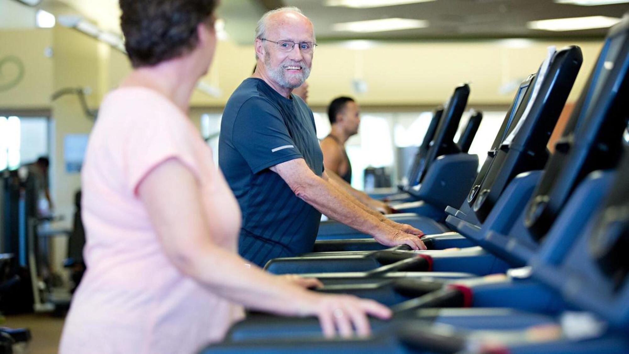 man and woman on treadmill